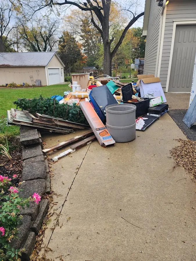 Dumpster being loaded with debris for 3 Yard Dumpster Rental in Chaffee